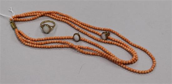 A triple strand coral bead necklace and a 9ct gold and white opal ring and pair of matching earrings.